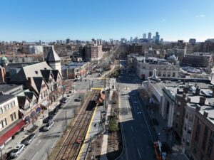 aerial drone photo of Brookline, MA with the Boston skyline in the distance